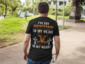Man wearing Black Short Sleeve Graphic Tee with printed quote : I have Hunting in my veins, Jesus in my heart.